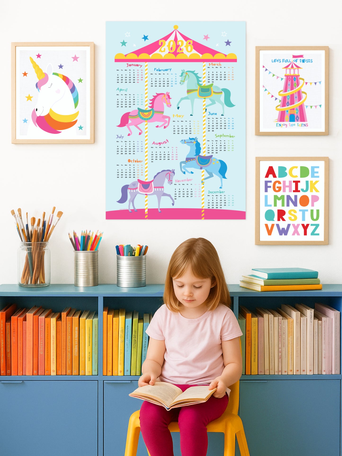 Child sitting on a chair reading a book in front of colorful wall posters including a 2026 carousel calendar and bookshelves.