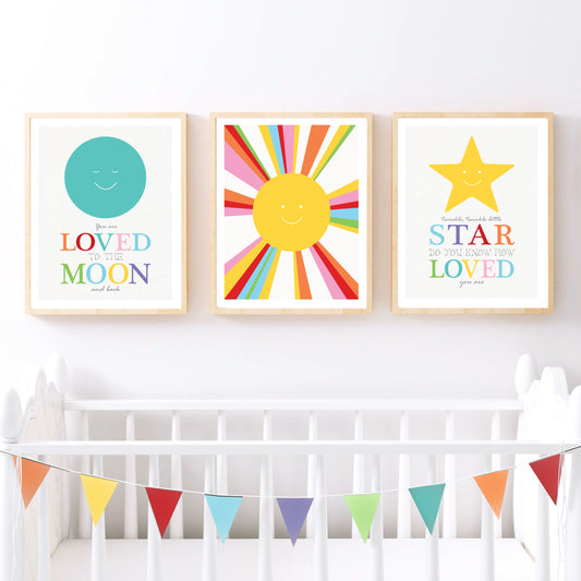 space themed kids art prints above a cot