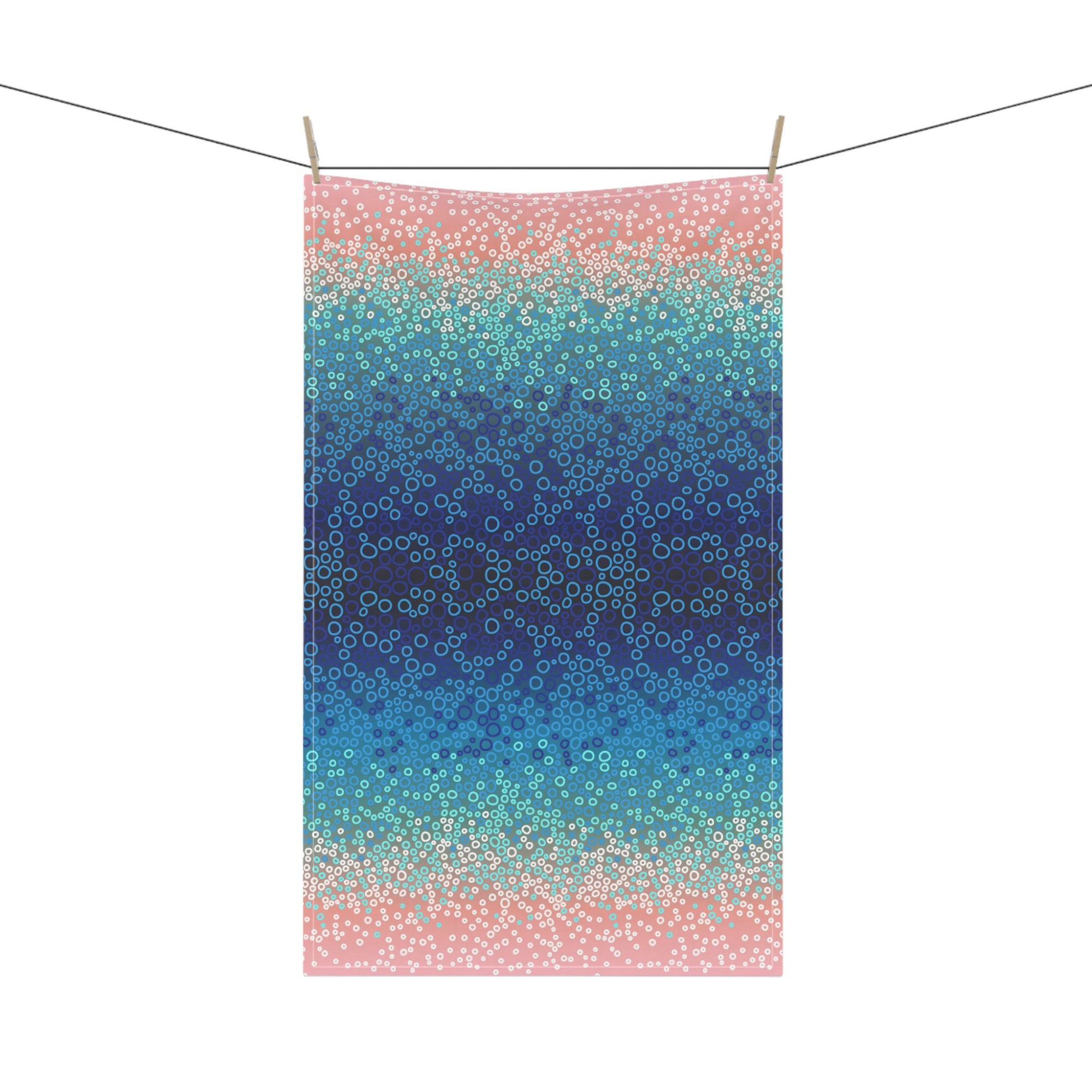 stunning tea towel, featuring a mesmerising gradient of blues, turquoise, and pinks with intricate circular pattern