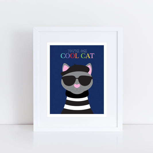 Art print featuring a grey cat wearing a black beret and dark sunglasses against a deep navy blue background. The cat has a pink heart-shaped nose and is dressed in a black and white striped jumper. Above the cat, the text reads "You're One Cool Cat" in a playful rainbow font.