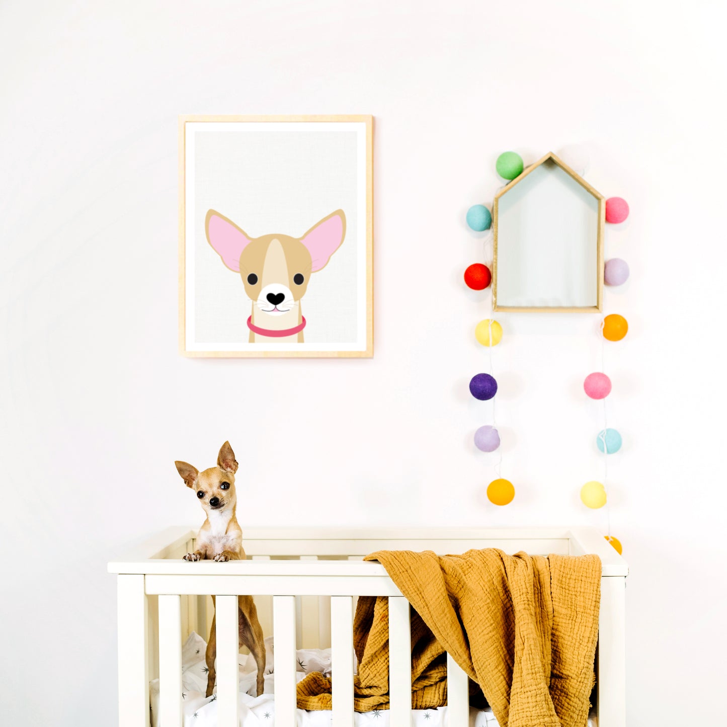 Chihuahua print in nursery above a cot with Chihuahua dog inside