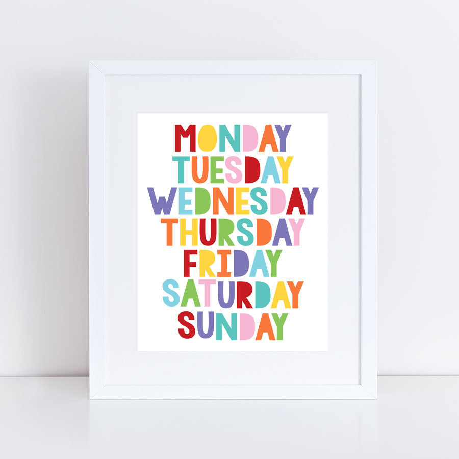 educational print of days of the week framed in a nursery