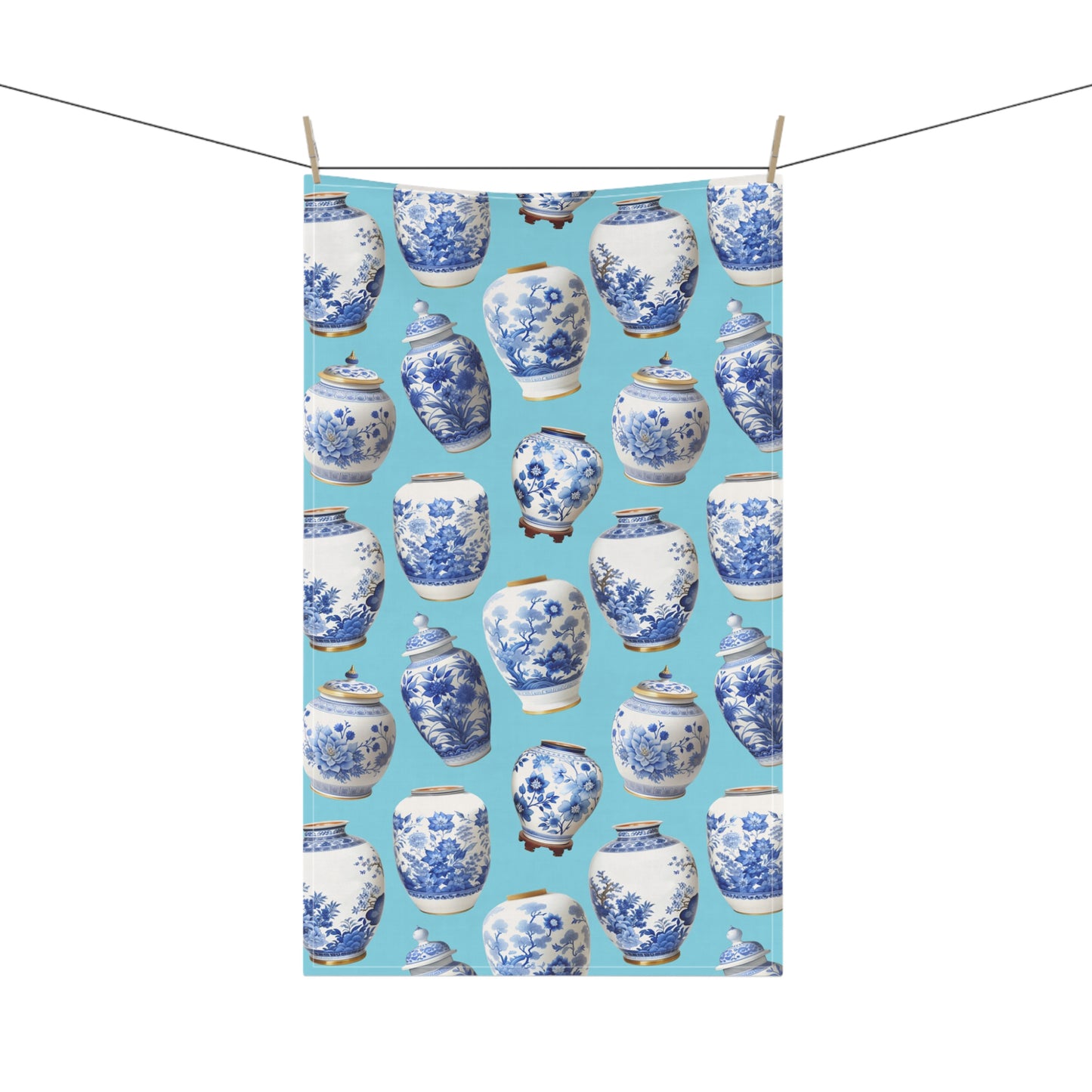 beautiful tea towel, showcasing blue and white ginger jars against a soft light blue background