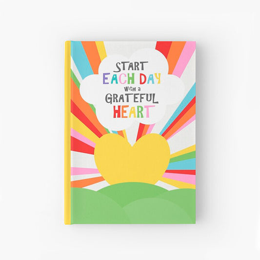 A beautiful hardcover journal with a colourful illustration and inspirational quote on the cover "Start each day with a grateful heart"