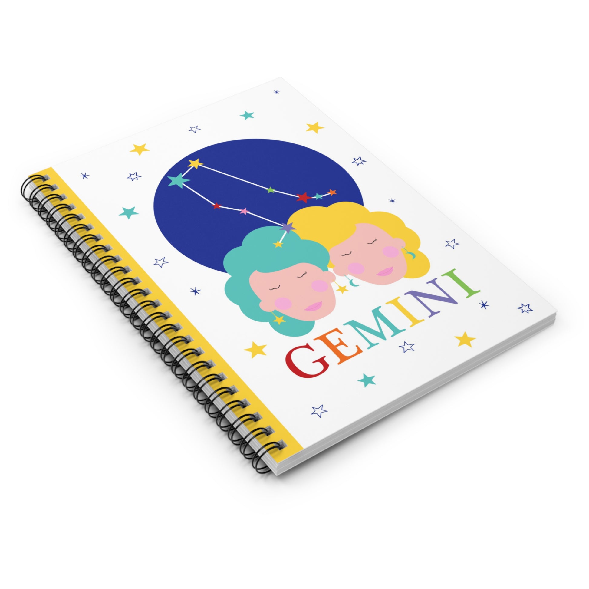 Angled view of the Gemini zodiac notebook with starry background and spiral binding