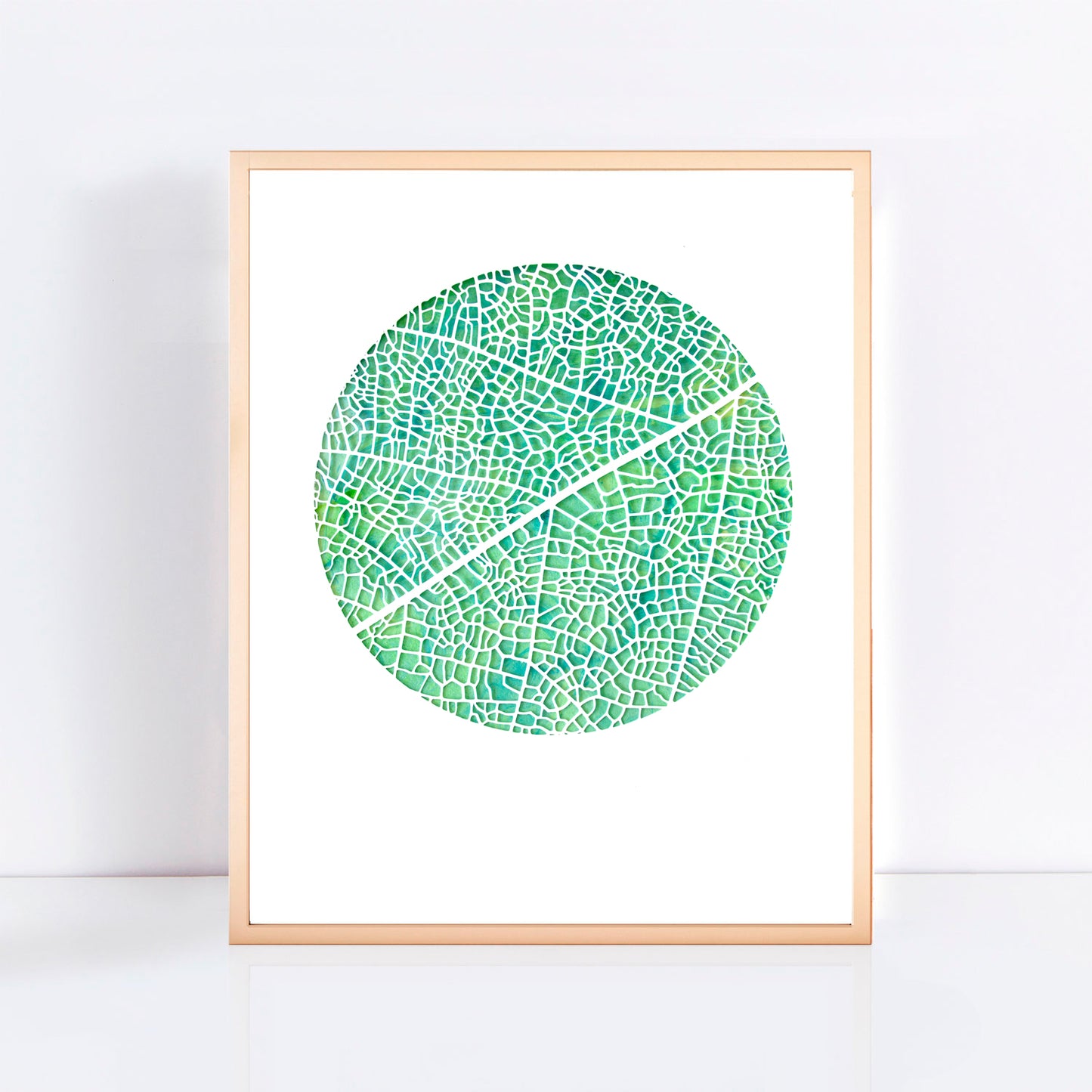 green circle print in a frame taken from an original cut paper artwork