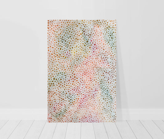 print leaning against wall of abstract painting in shades of peach, green and brown