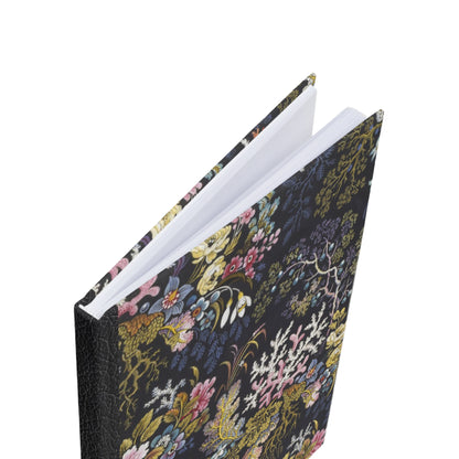 top view of a vintage style notebook with flowers and coral illustrations