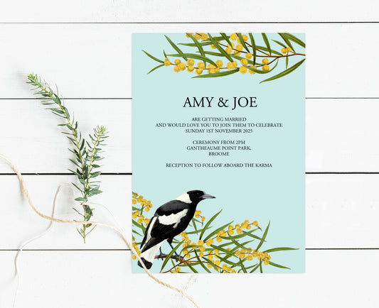 nvitation with yellow wattle flowers and a bold black and white magpie