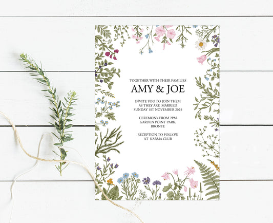 invitation surrounded by flowers