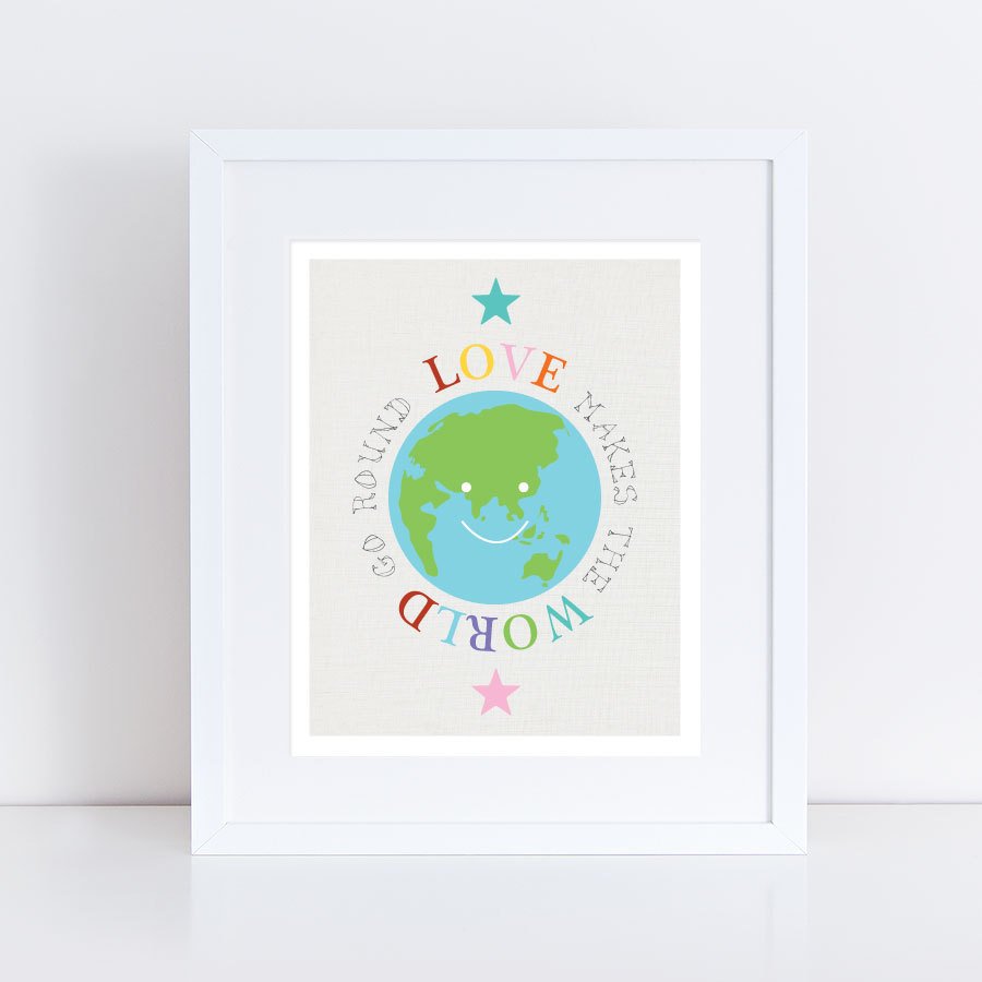 print of earth in frame with words Love makes the world go round around it