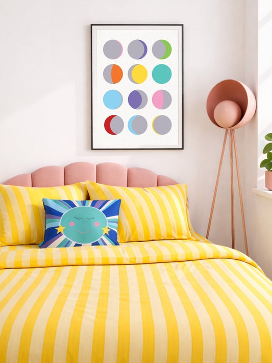 Colourful teen bedroom with moon phases wall art, yellow striped bedding and playful sun and moon cushion