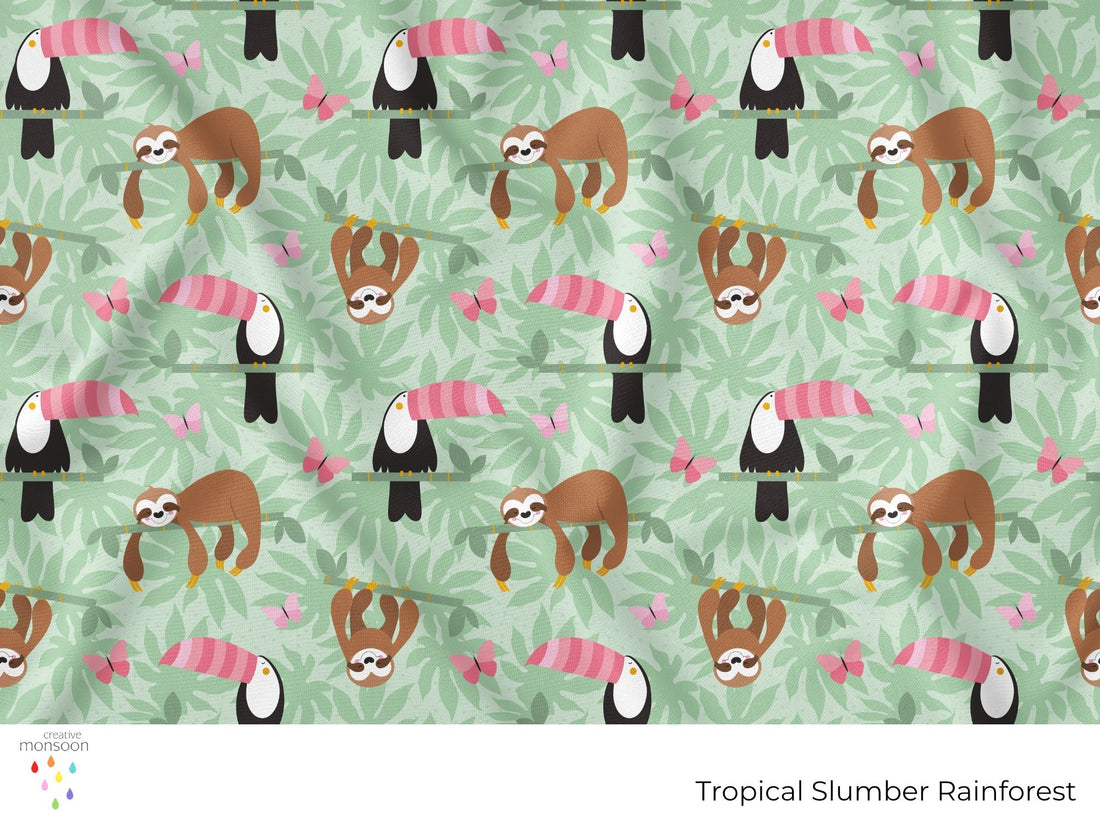 Tropical rainforest surface pattern featuring sloths and toucans hidden amongst layered jungle foliage in soft green and pink tones.