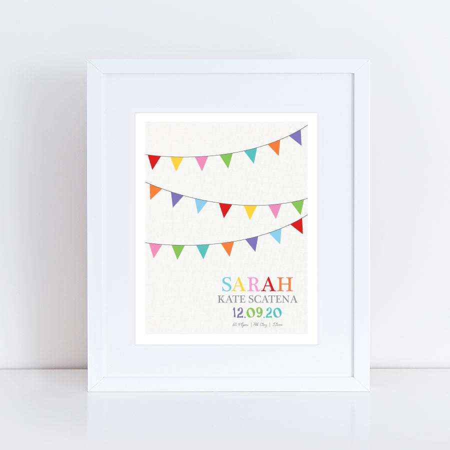 Colourful rainbow bunting with custom birth stats underneath print in frame