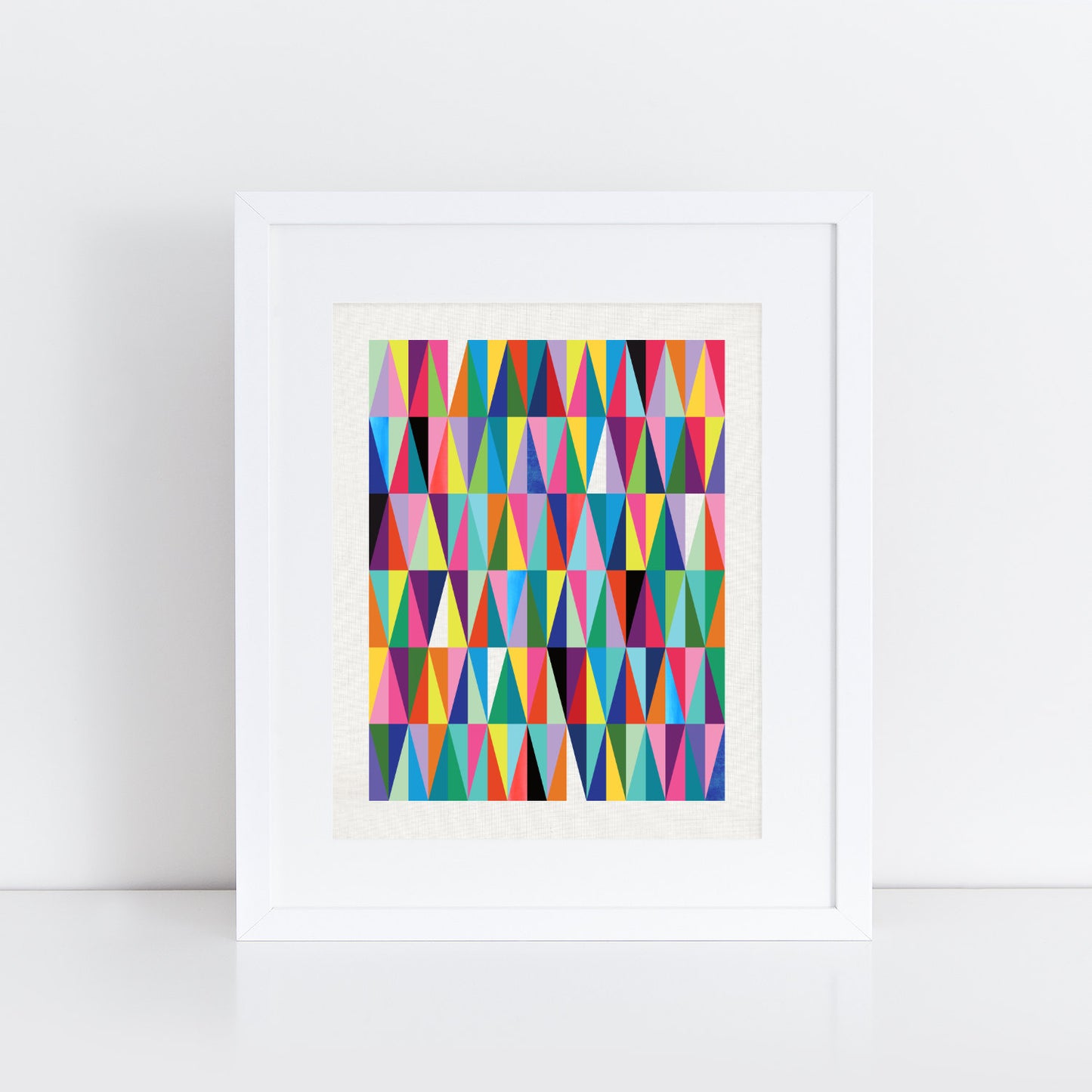 bright, colourful, playful geometric diamonds and triangles print in a mix of rainbow shades,