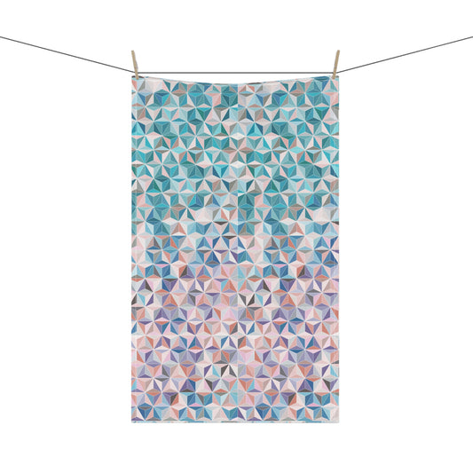 colourful tea towel, featuring a stunning pattern of interlocking triangles in beautiful pinks, blues and turquoise tones