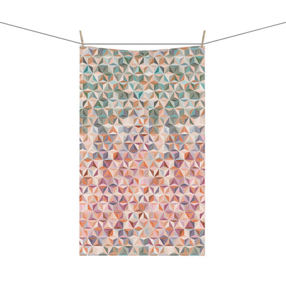 colourful tea towel, featuring a stunning pattern of interlocking triangles in soft pastel and earthy tone