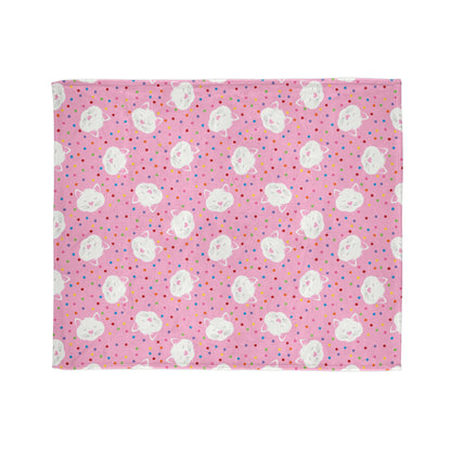 playful blanket, featuring sleepy kitty faces surrounded by bright confetti dots on a cheerful pink background