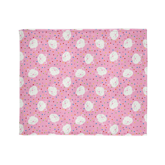 playful blanket, featuring sleepy kitty faces surrounded by bright confetti dots on a cheerful pink background