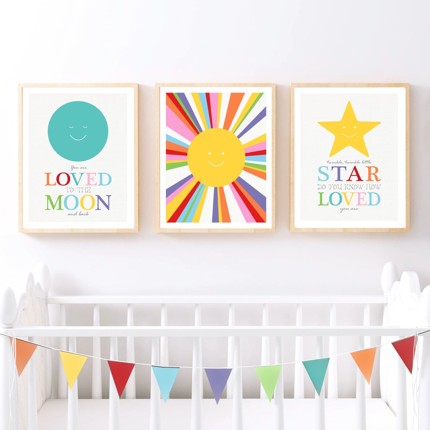 space themed kids art prints above a cot