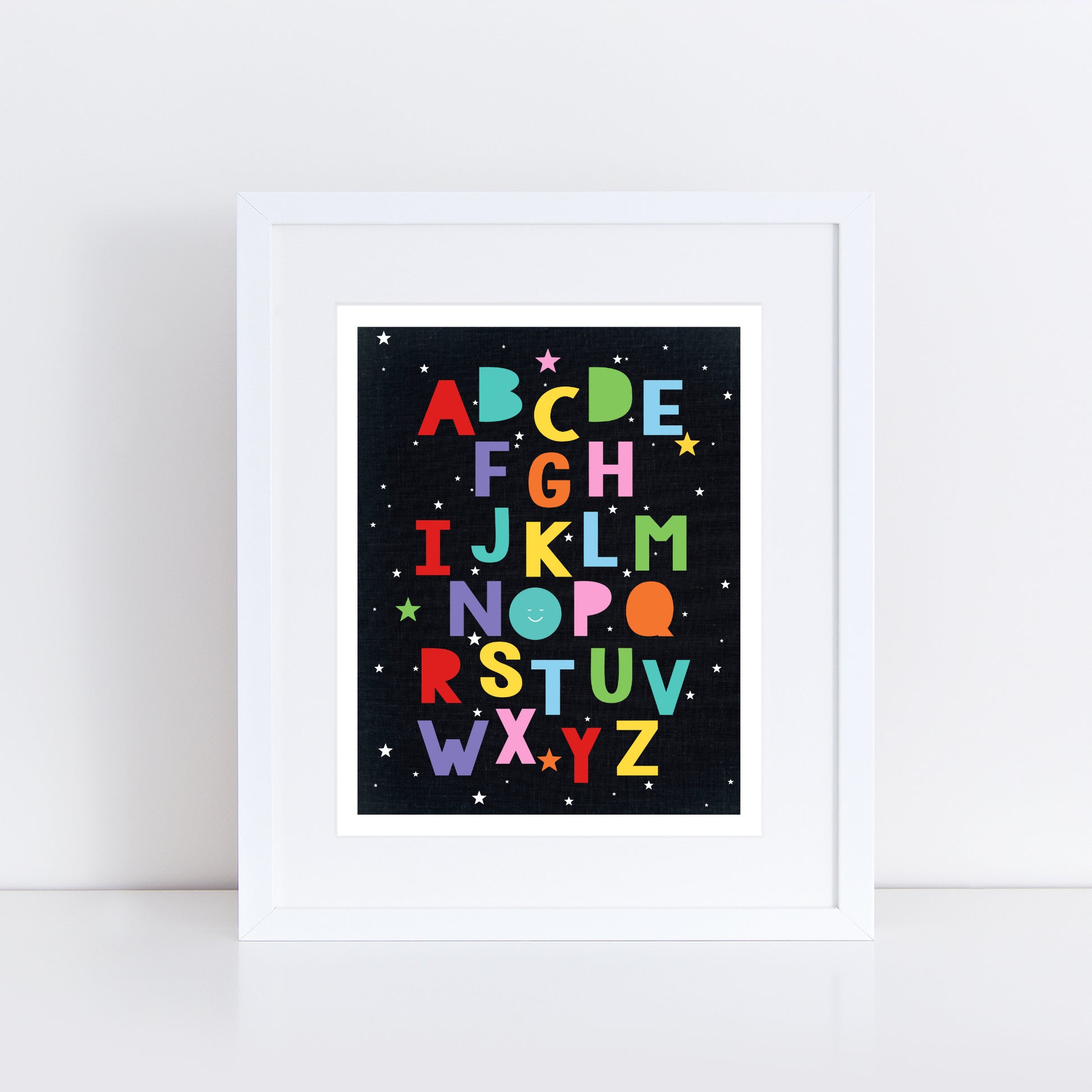 Print of colourful alphabet surrounded by stars in a frame