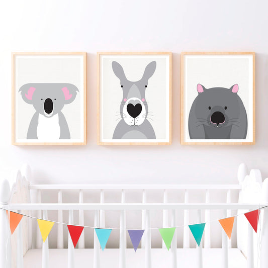 A cute Australian animals print set with a kangaroo, koala and wombat in child's room nursery over cot