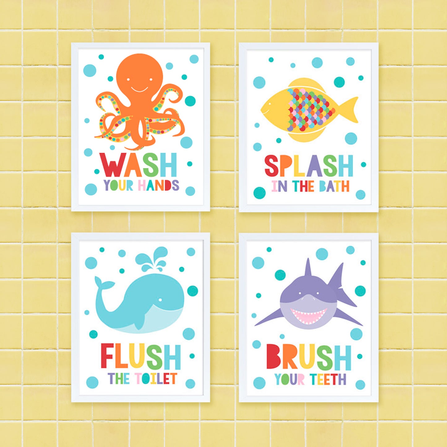 colourful set of kids bathroom prints with octopus, fish, whale and shark on yellow tiles