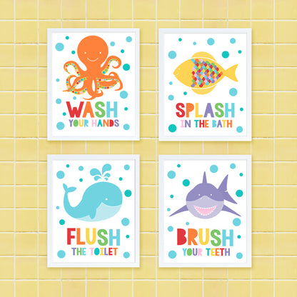 colourful set of kids bathroom prints with octopus, fish, whale and shark on yellow tiles