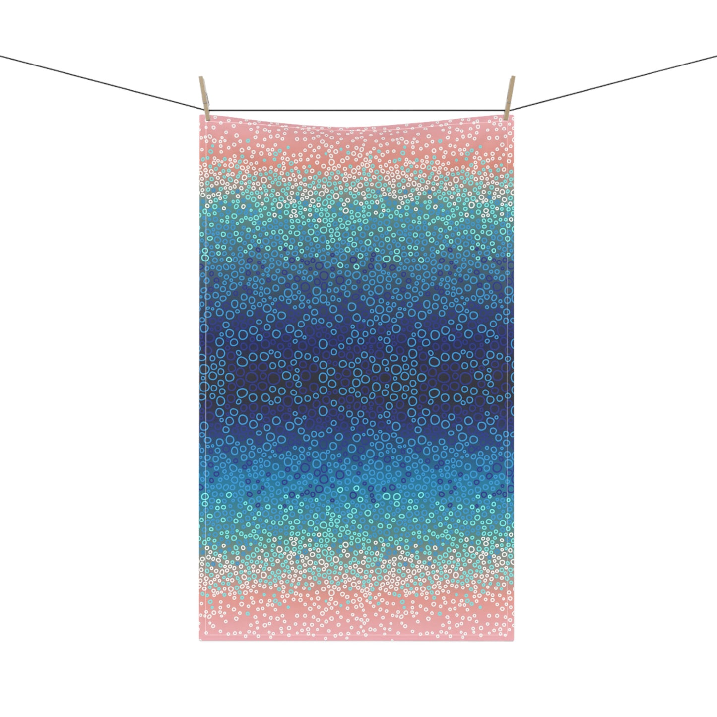 stunning tea towel, featuring a mesmerising gradient of blues, turquoise, and pinks with intricate circular pattern