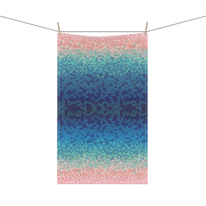 stunning tea towel, featuring a mesmerising gradient of blues, turquoise, and pinks with intricate circular pattern