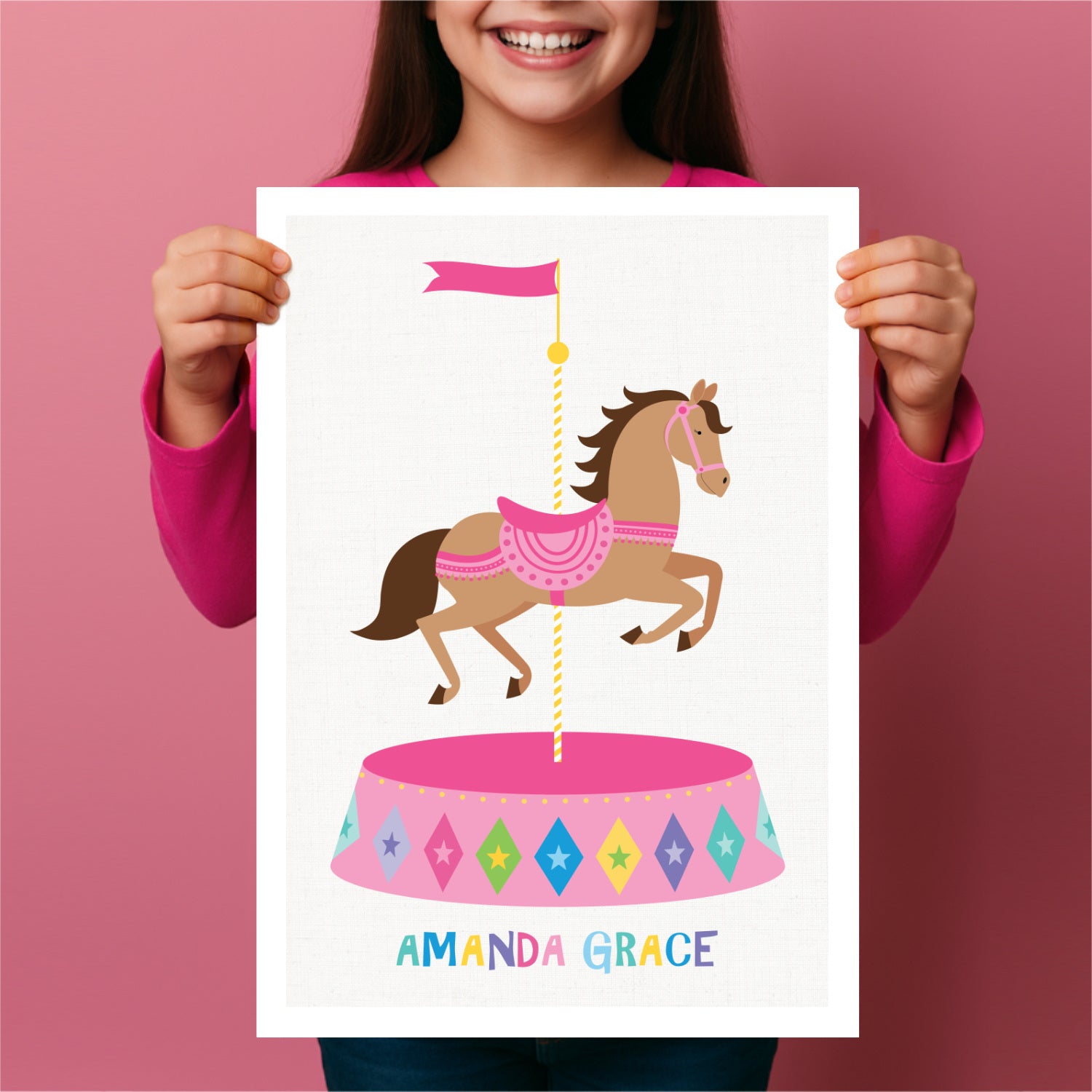 Child holding a poster with a carousel horse design and personalised text 