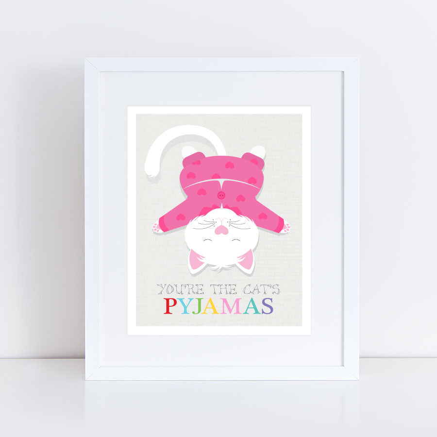 print of cat in pink pyjamas lying upside down