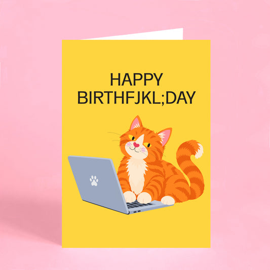 Funny cat birthday card featuring a ginger cat sitting on a laptop with a mistyped Happy Birthday message.