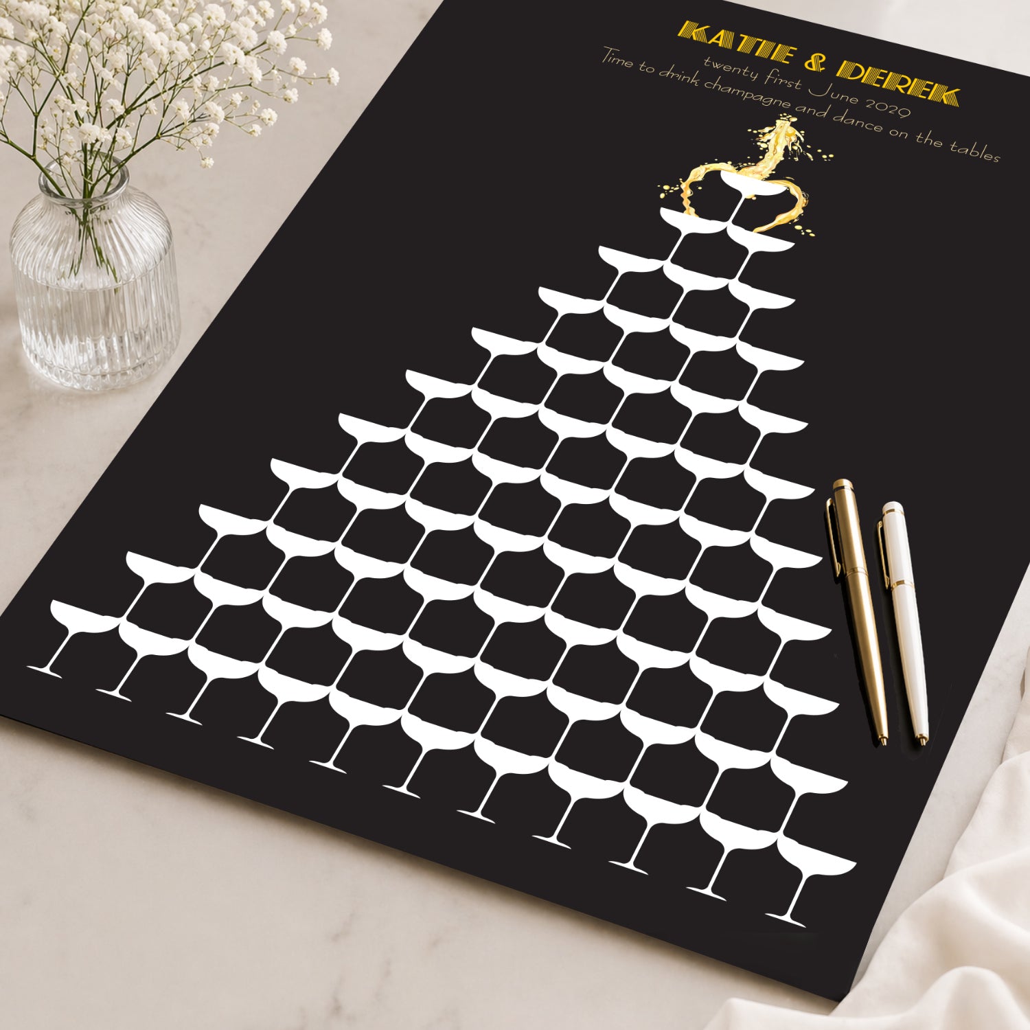 Signature wedding guest book with champagne glass design on a black background, customised with the bride and grooms name and a date.