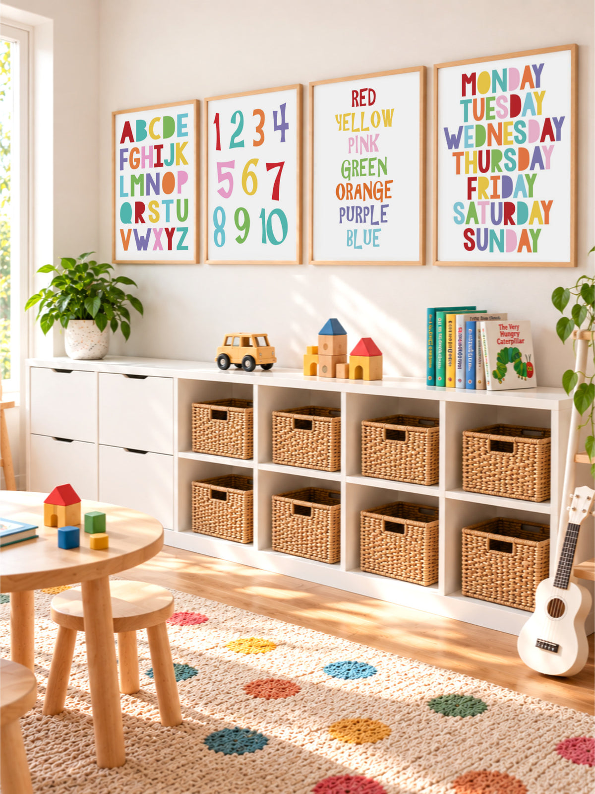 Colourful educational kids art prints featuring alphabet, numbers, colours and days of the week in a bright playroom