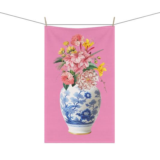  tea towel, adorned with a striking arrangement of pink and yellow flowers in a ginger jar