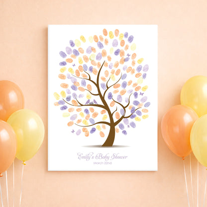 Fingerprint tree artwork at a baby shower with balloons 