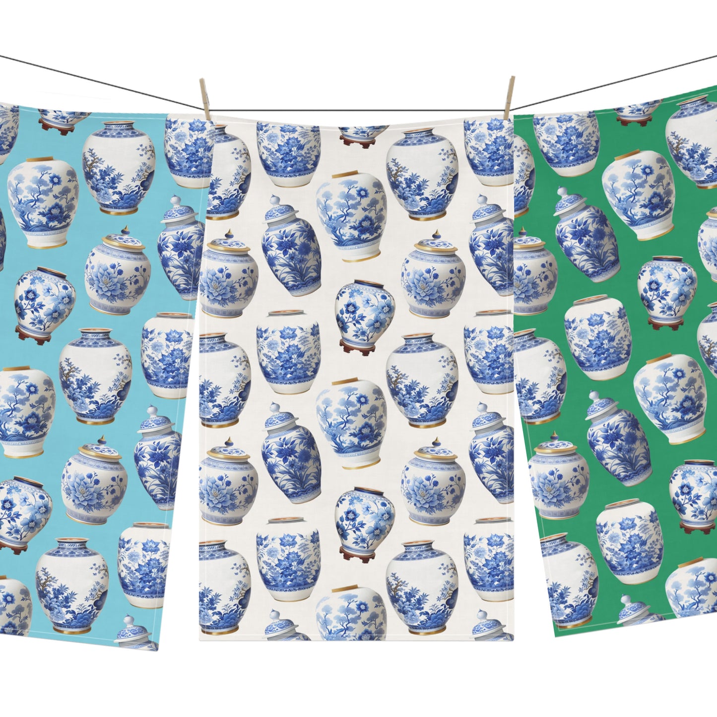 Set of three tea towels with blue and white ginger jar patterns on white, blue and green backgrounds