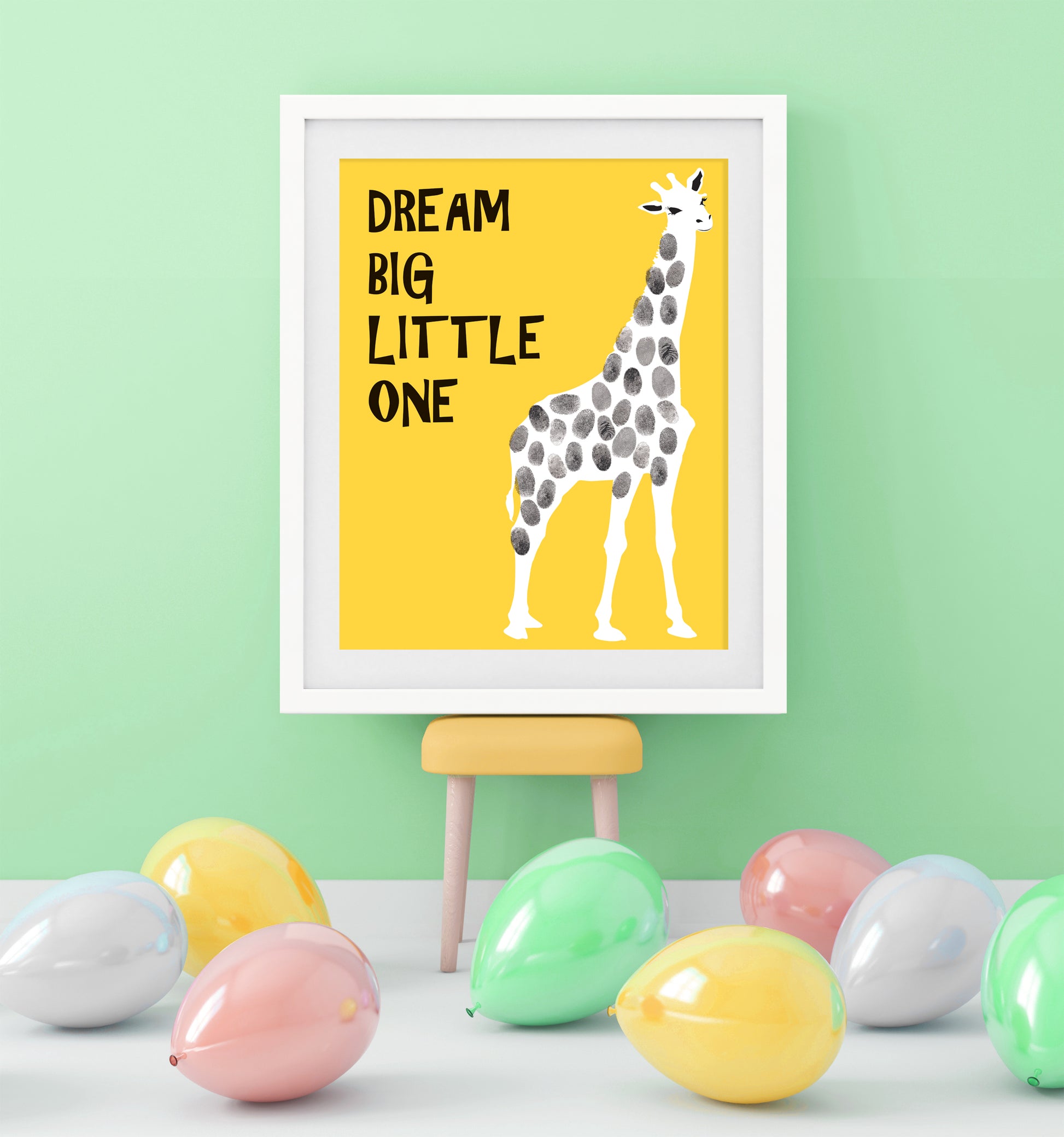 kids' party in green room with giraffe fingerprint keepsake guest book poster in frame surrounded by balloons
