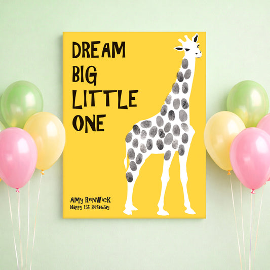 Canvas print with a giraffe illustration and text 'Dream Big Little One' on a yellow background, surrounded by balloons.