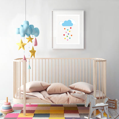 baby nursery with cloud mobile and pretty print of a cloud raining colourful rainbow hearts 