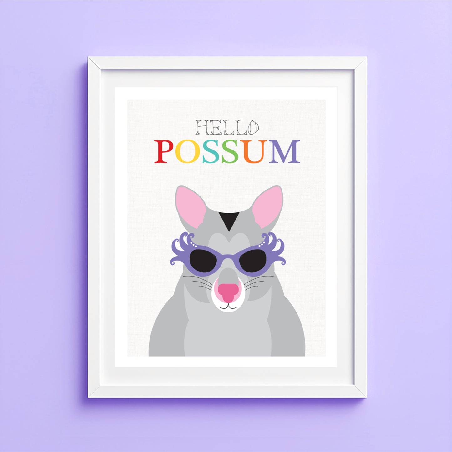 Framed artwork of a possum with sunglasses and 'Hello Possum' text on a purple wall