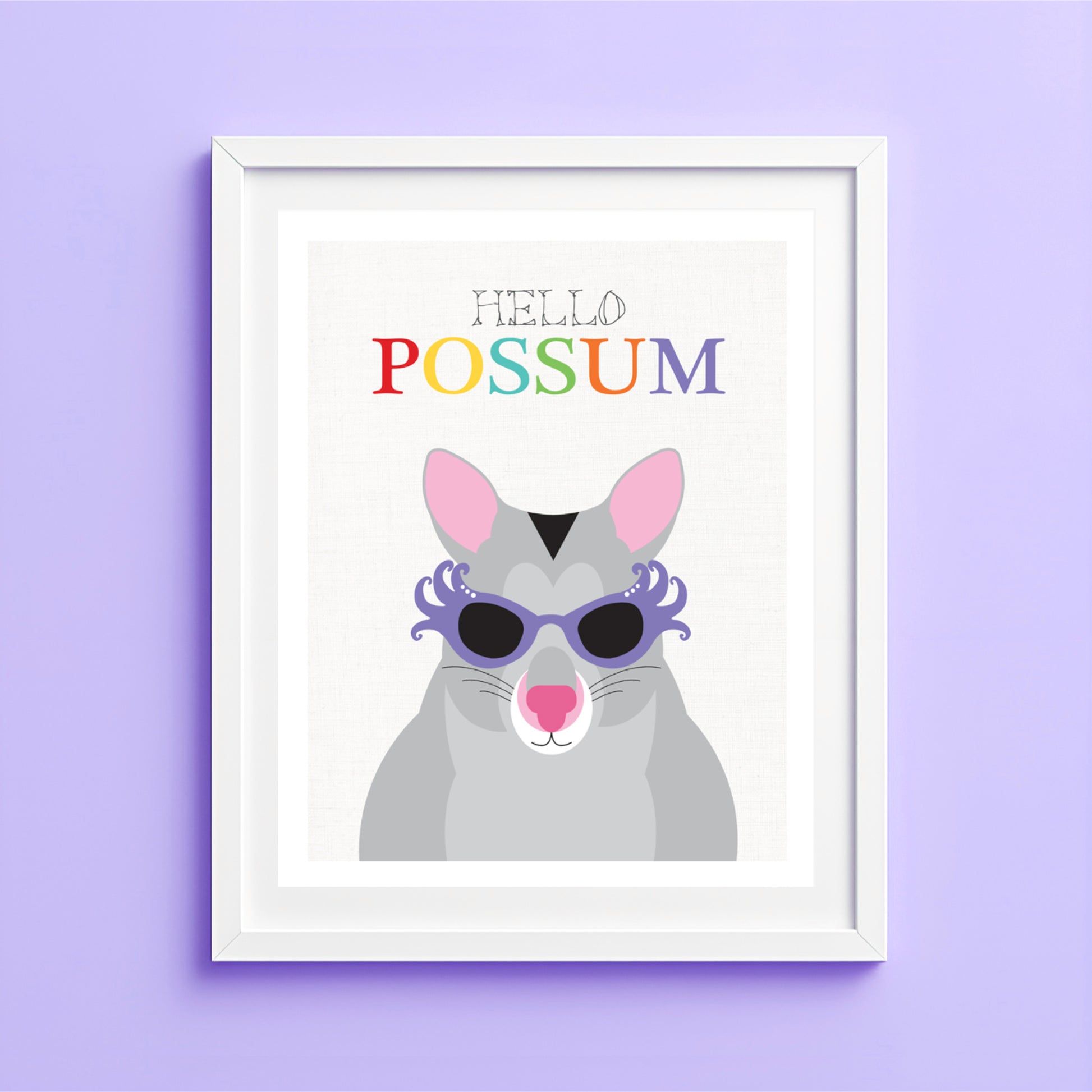 Framed artwork of a possum with sunglasses and 'Hello Possum' text on a purple wall