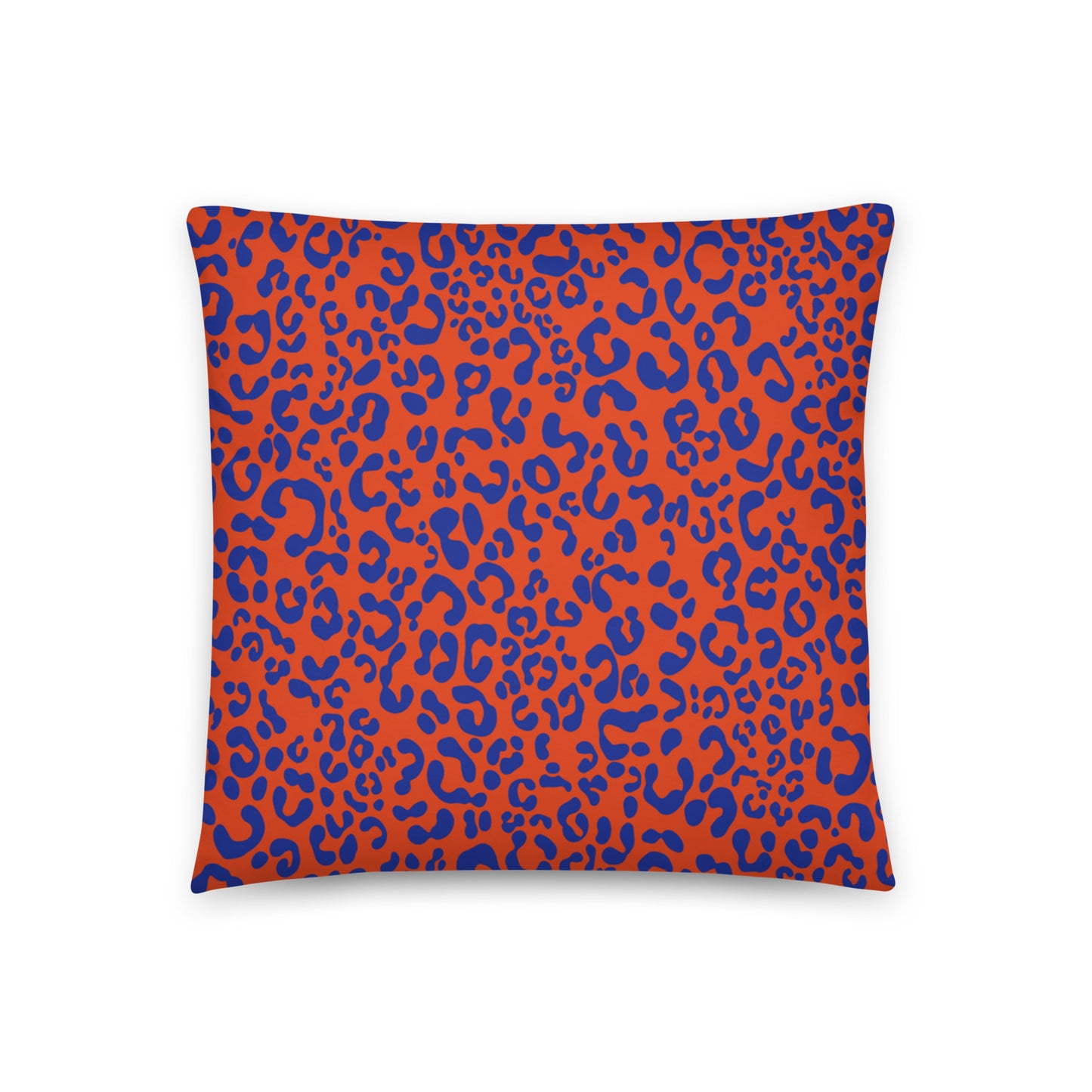  vibrant cushion cover features a striking orange backdrop to a bold blue leopard print pattern