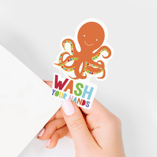 hand holding octopus sticker with wash your hands