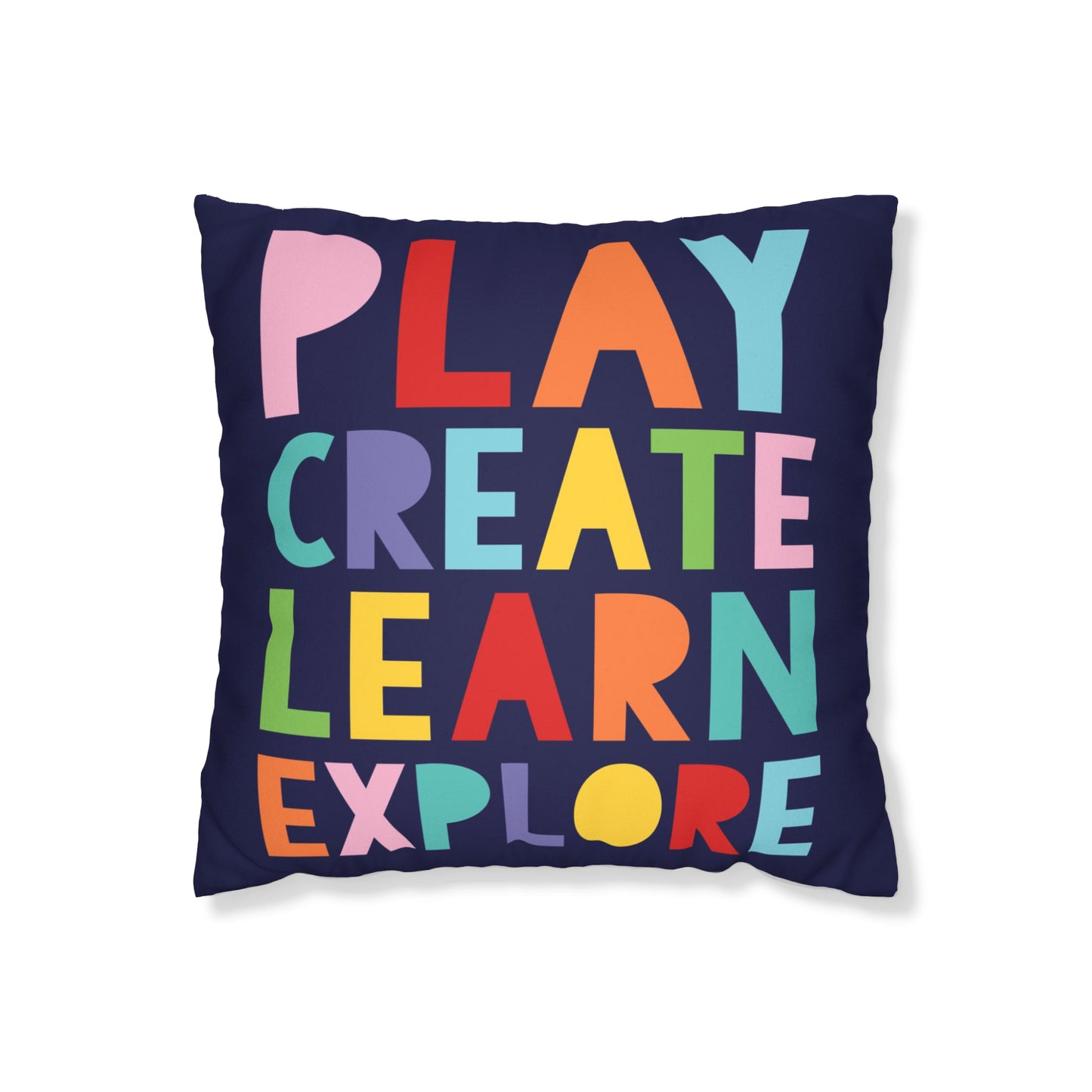 bold cushion cover with the words "Play Create Learn Explore"