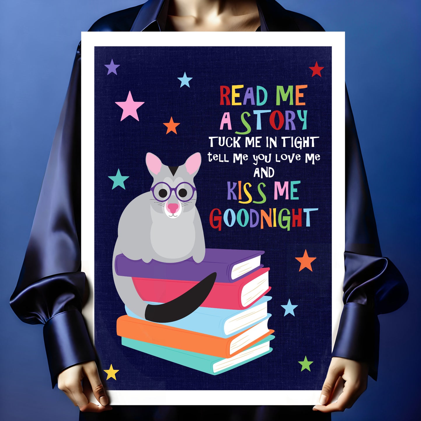 Person holding a children’s wall art print with possum illustration and sweet bedtime saying