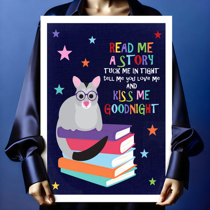 Person holding a children’s wall art print with possum illustration and sweet bedtime saying