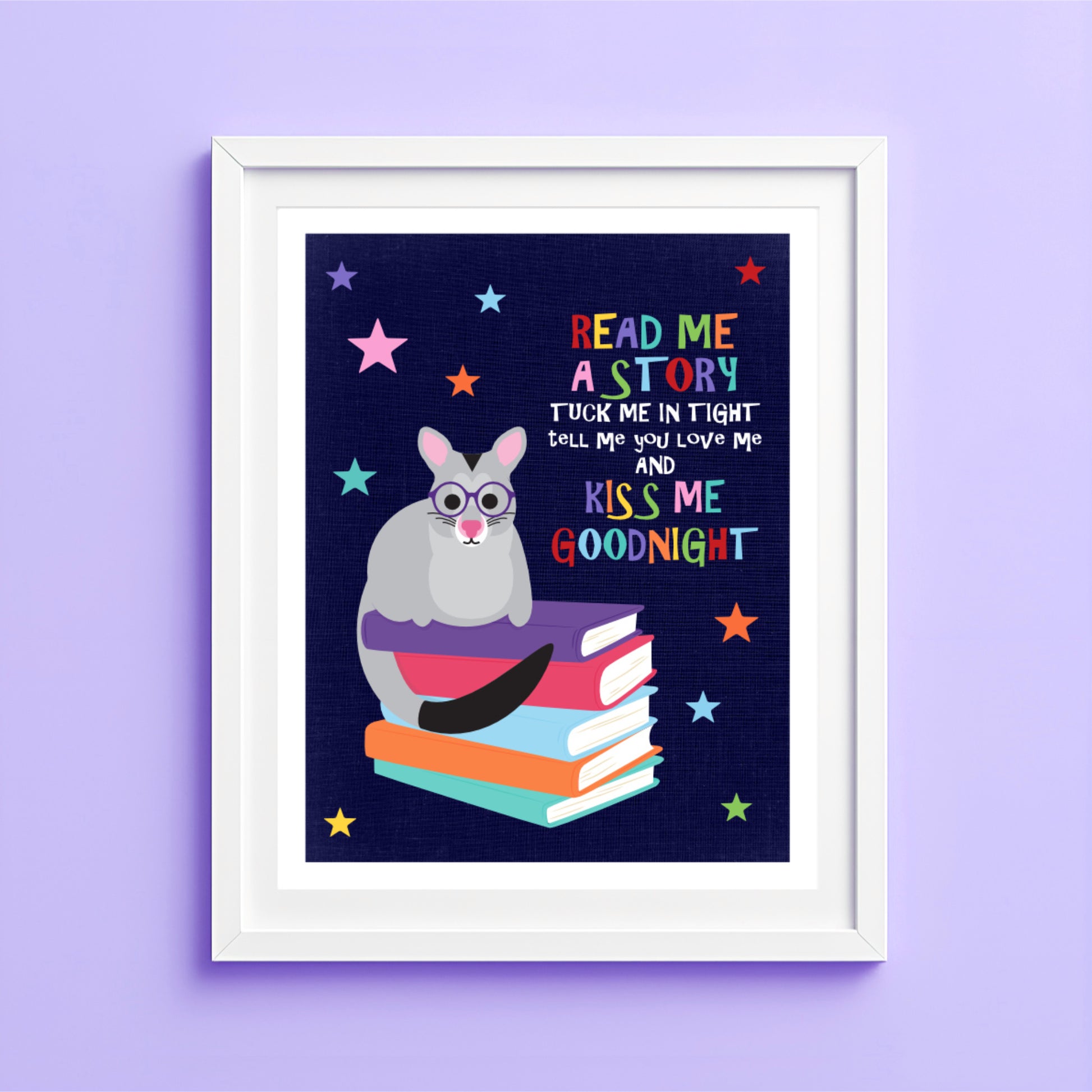 Children's wall art with a possum on books and text against a starry sky