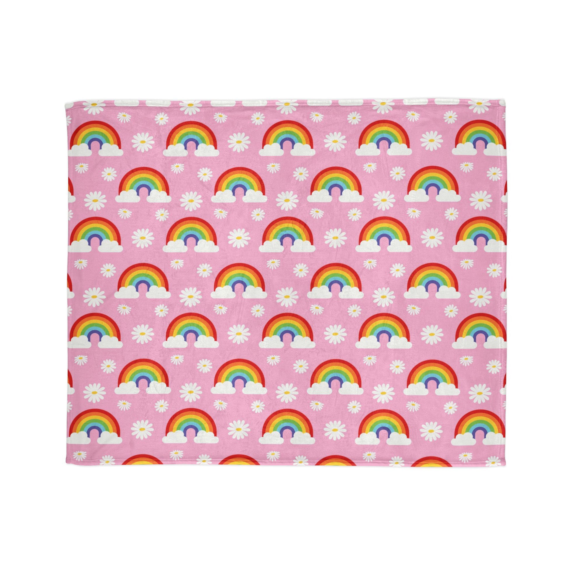 super-soft, cozy blanket features a fun and cheerful pattern of rainbows, clouds, and daisies on a pretty pink background